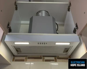 A ceiling-mounted air conditioning unit installed in a clean, white space.